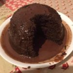 Steamed chocolate sponge pudding with chocolate sauce cooked in slow cooker