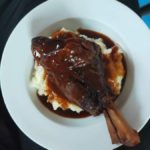 Slow Cooked Lamb Shanks In Red Wine Sauce On Mash Potato